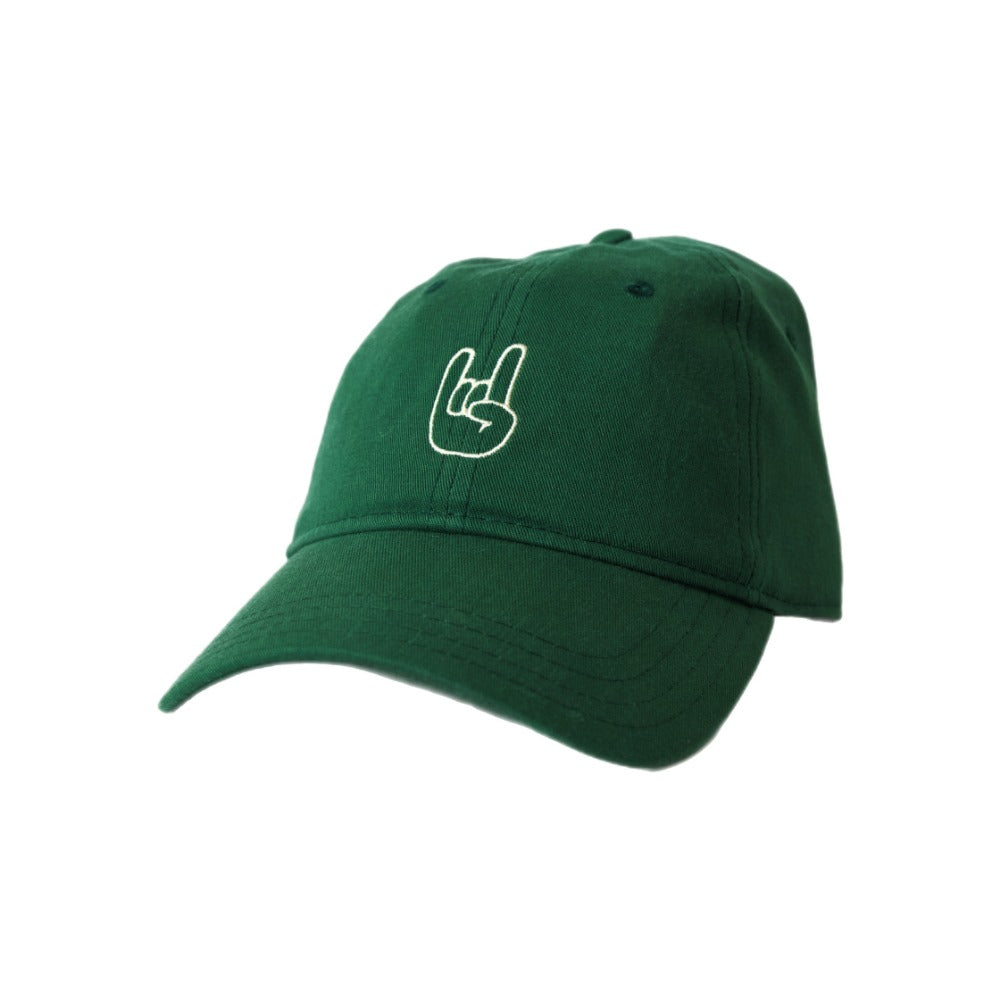 green rock on hat with rock on hand sign in cream on white background.