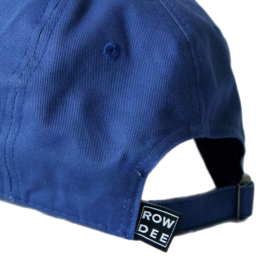 slate blue rowdee rock on dad cap with custom rowdee tag and metal slide adjuster on white background